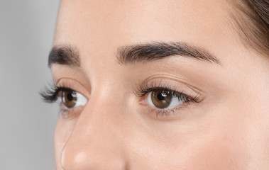 Obraz premium Young woman with beautiful eyelashes, closeup view