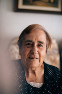 Portrait of smiling senior woman at home