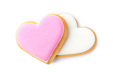 Decorated heart shaped cookies on white background