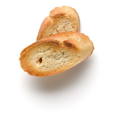 Toasted baguette slices isolated on white background close up.  Toast, crouton.   Top view.