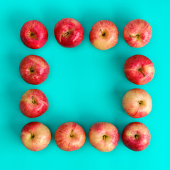 Fruit pattern of red apple on blue background. Flat lay, top view. Pop art design, creative summer concept. Food background.