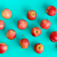 Fruit pattern of red apple on blue background. Flat lay, top view. Pop art design, creative summer concept. Food background.