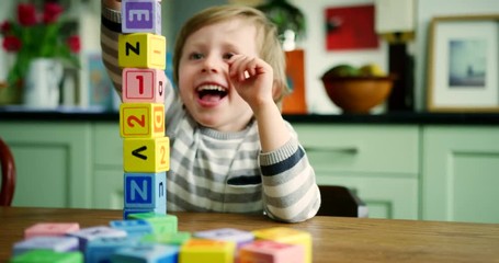 Young Blond Boy Stacking Wooden Blocks - Powered by Adobe