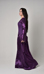full length portrait of beautiful girl with long black hair,   wearing purple fantasy medieval...