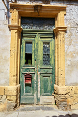 Fototapeta na wymiar Old authentic green doors in Nicosia