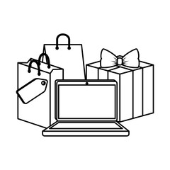 laptop with shopping bag and gift