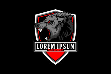 aggressive and angry wolf head vector with shield crest or badge logo template © infernal  kiss