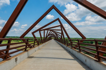 Twisting Bridge Over Rails to Trail