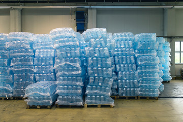 Pallets of water bottles in warehouse