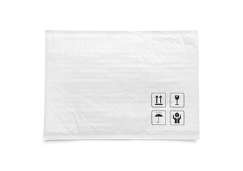 White postal package. Plastic parcel with fragile care sign and symbol. Object isolated on white...