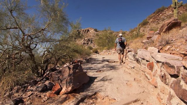 People hike up and down on the mountains of Phoenix.  The Mountains Preserve Park is a traditional hiking place in Arizona.