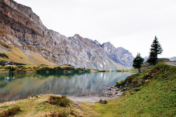 Naklejka na ściany i meble Trubsee lake with Mount Graustock and Swiss Alps of Engelberg