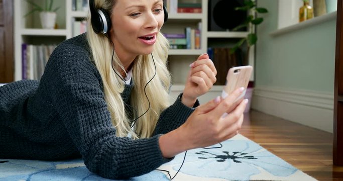 Beautiful Blond Woman Having Video Chat Using Smart Phone