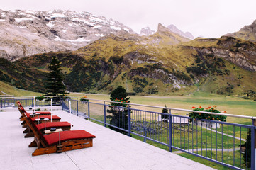 Resting terrace at Trubsee lake station with Mount Graustock and Swiss Alps of Engelberg