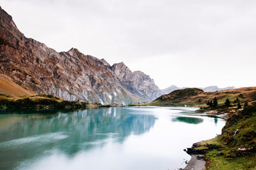 Fototapeta premium Trubsee lake with Mount Graustock and Swiss Alps of Engelberg