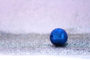 blue decorative ball on white sparkling background