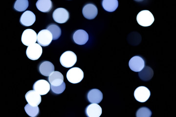 Abstract blue bokeh on dark background, Christmas blurred background