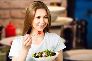 Attractive caucasian smiling woman with salad  isolated