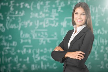 Portrait of a young businesswoman on background