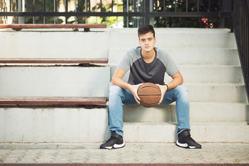 Beautifull teenage boy with basketball ball