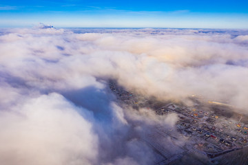 White clouds flying over rural area. Aerial landscape