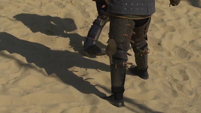 knight legs in armor during a duel