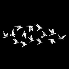 Isolated textured stipple silhouette of white birds flock in the black air Inspirational body flash tattoo ink. Vector.