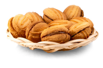 wicker vase with cake on white