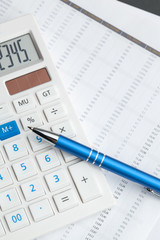 Business still life with calculator on table in office.