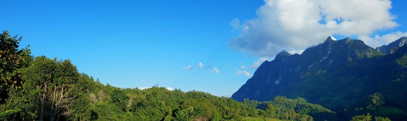 Fototapeta premium Panoramic view for landscape on mountain with sky and cloud, peace and relaxation, Beautiful nature to make our mind calm, copy space, Doi Chiang Dao at Thailand