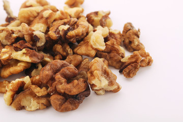 A pile of peeled walnuts at white background