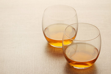 Two glasses with whiskey without ice cubes