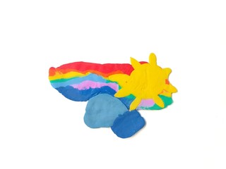 Fototapeta premium Colorful plasticine clay handmade are beautiful rainbow clouds and sun on white background,  abstract sky natural dough