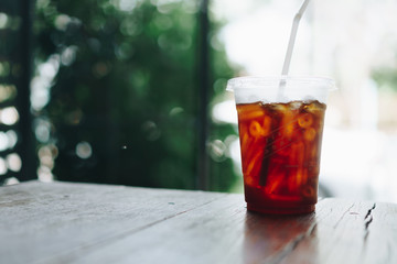 Black coffee or Americano on table with film vintage tone background.
