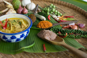 Food on rustic wooden background. Spices ingredients chilli ,pepper, garlic,lemongrass and kaffir lime leaves,Spices made from a variety of spices in Thai style.