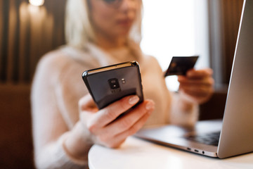 Payment Detail page display. Online payment. Women hands using s