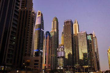 Dubai, UAE - November 29, 2018: Dubai's high rise houses in the evening. Dubai Marina district.