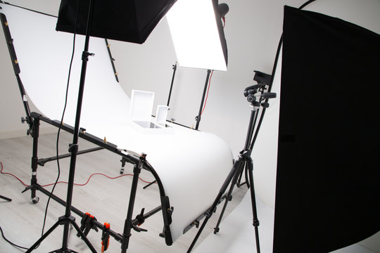 Lighting setup in studio for commercial works such as photo object product with big softbox snoot reflector umbrella and tripods