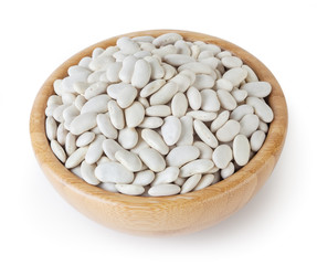 Uncooked lima beans in wooden bowl isolated on white background with clipping path