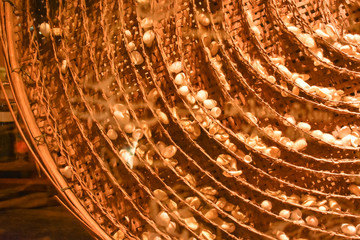Golden cocoon of silk worms in baskets.