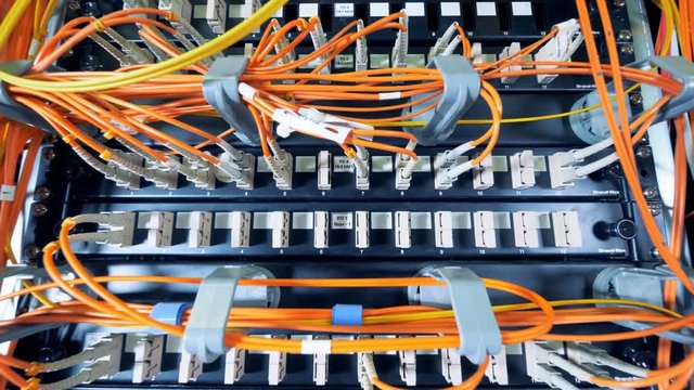 Slots of data servers with a lot of wires plugged into them