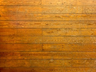 Naklejka premium Top view on an old parquet floor. Can be used as a background.