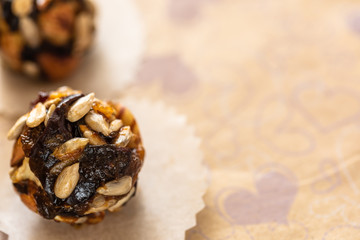 Close-up top view organic energy balls handmade on wrapping paper.