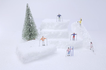 mini figure playing fun with snow slider.