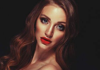 Fototapeta premium Blonde fashion girl with long and shiny curly hair.