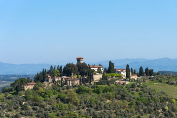 Fototapeta na wymiar Beautiful tuscan landscape of a small rural town on the hill, Chianti, Italy