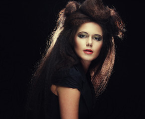 Fototapeta premium young woman with long colored brown hair and bright make-up