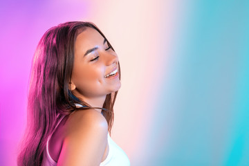 Portrait of beautiful girl in studio with color filters.