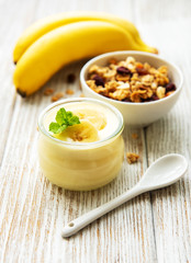 Banana yogurt, granola and fresh bananas