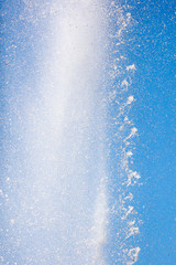 Splashes of water against the blue sky